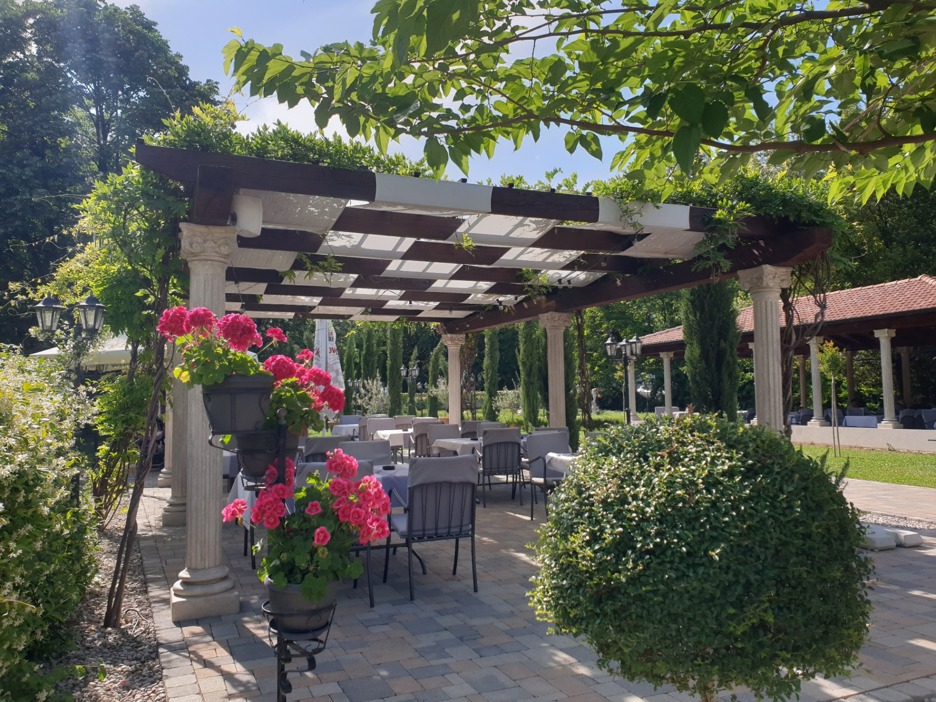 Garden pergola terrace with classical columns at Restaurant Radobolja